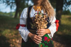 Woman hands holds bunch of flowers