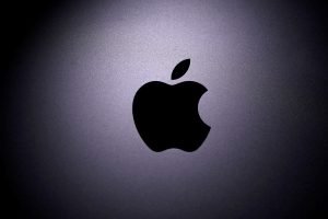 FILE PHOTO: Apple logo is seen on a Macbook in this illustration