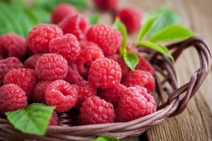 Ripe raspberry with leaf