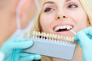 Closeup of a girl with beautiful smile at the dentist