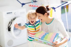 Family in laundry room with washing machine