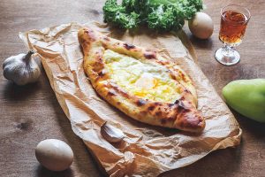 Ajarian Khachapuri traditional Georgian cheese pastry with eggs