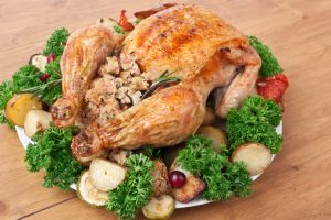 Stuffed chicken on a garnished platter