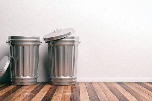 Trash cans on a wooden floor 3d illustration