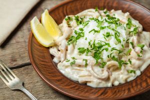 Squid in sour cream sauce. Greek national dish.