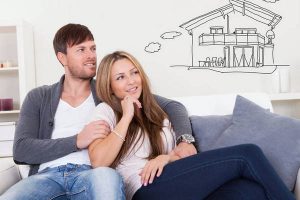Cheerful young couple dreaming about the future