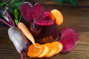 beet-Carrot juice in glass on  table
