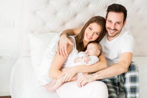 Happy family with newborn baby