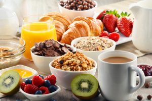 Breakfast served with coffee, juice, croissants and fruits