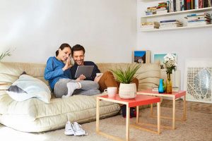 Happy couple video chatting on digital tablet