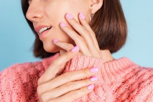 beauty-concept-pretty-woman-with-bright-pink-nail-color-manicure-wall-1024x683