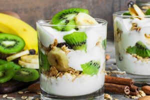 healthy breakfast. homemade yogurt parfait with granola and fruits