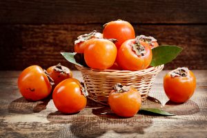 fresh persimmons in a basket