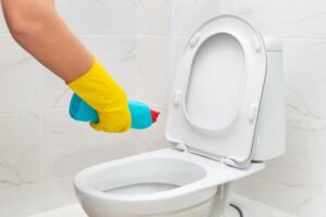 Cleaner,In,Yellow,Rubber,Gloves,Pouring,Detergent,Under,Rim,Of