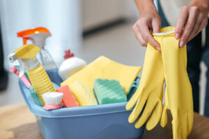 Close up picture of female hands taking on gloves