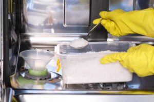 A,Woman,Adds,Salt,To,The,Detergent,Solution,In,The