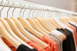 Clothes,Hang,On,A,Shelf,In,A,Designer,Clothes,Store