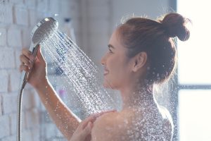 Asian,Woman,Enjoying,The,Shower,She,Feels,Relaxed