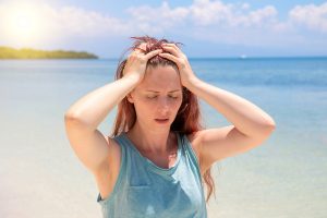 Severe,Headache,On,Tropic,Seaside,During,Vacation.,Bright,Sun,Negative