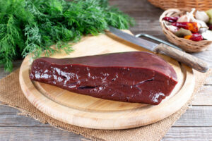 Raw,Liver,Ready,To,Cook,On,A,Wooden,Board,In